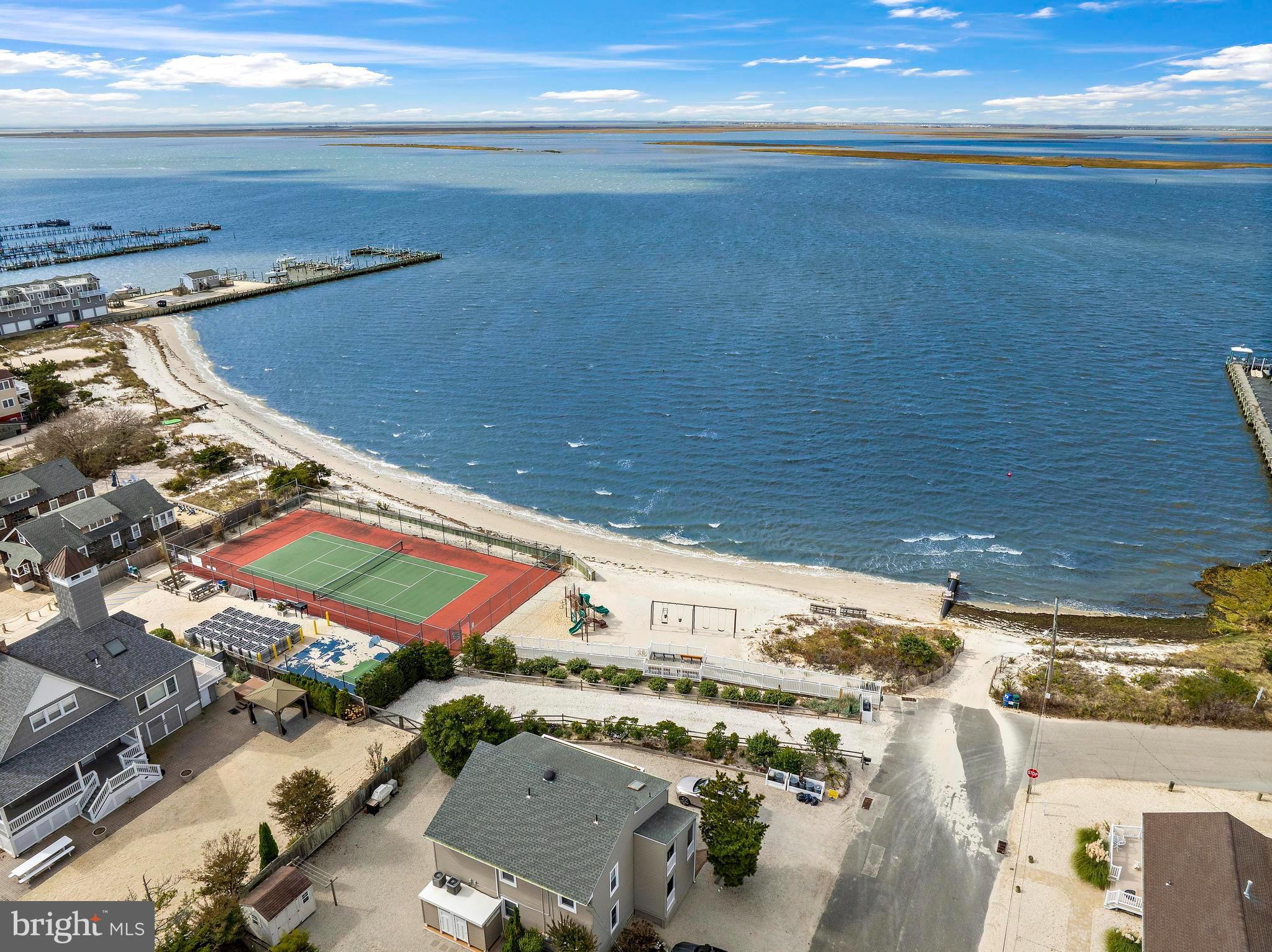 13 Joan Road, Unit 2 Long Beach Township, NJ 08008 - Photo 42 of 64 an aerial view of residential houses with outdoor space