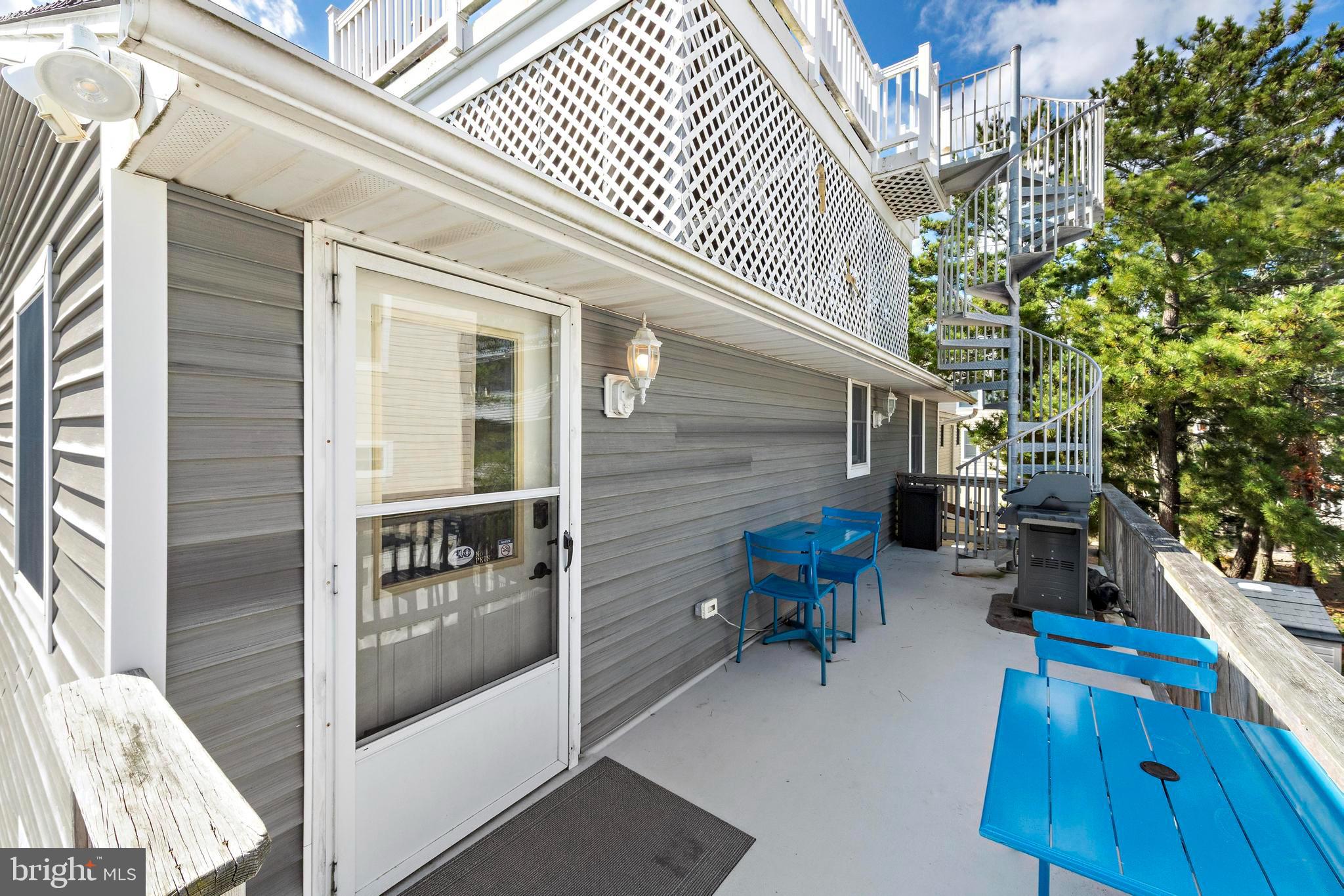 13 Joan Road, Unit 2 Long Beach Township, NJ 08008 - Photo 47 of 64 front view of a house with a patio