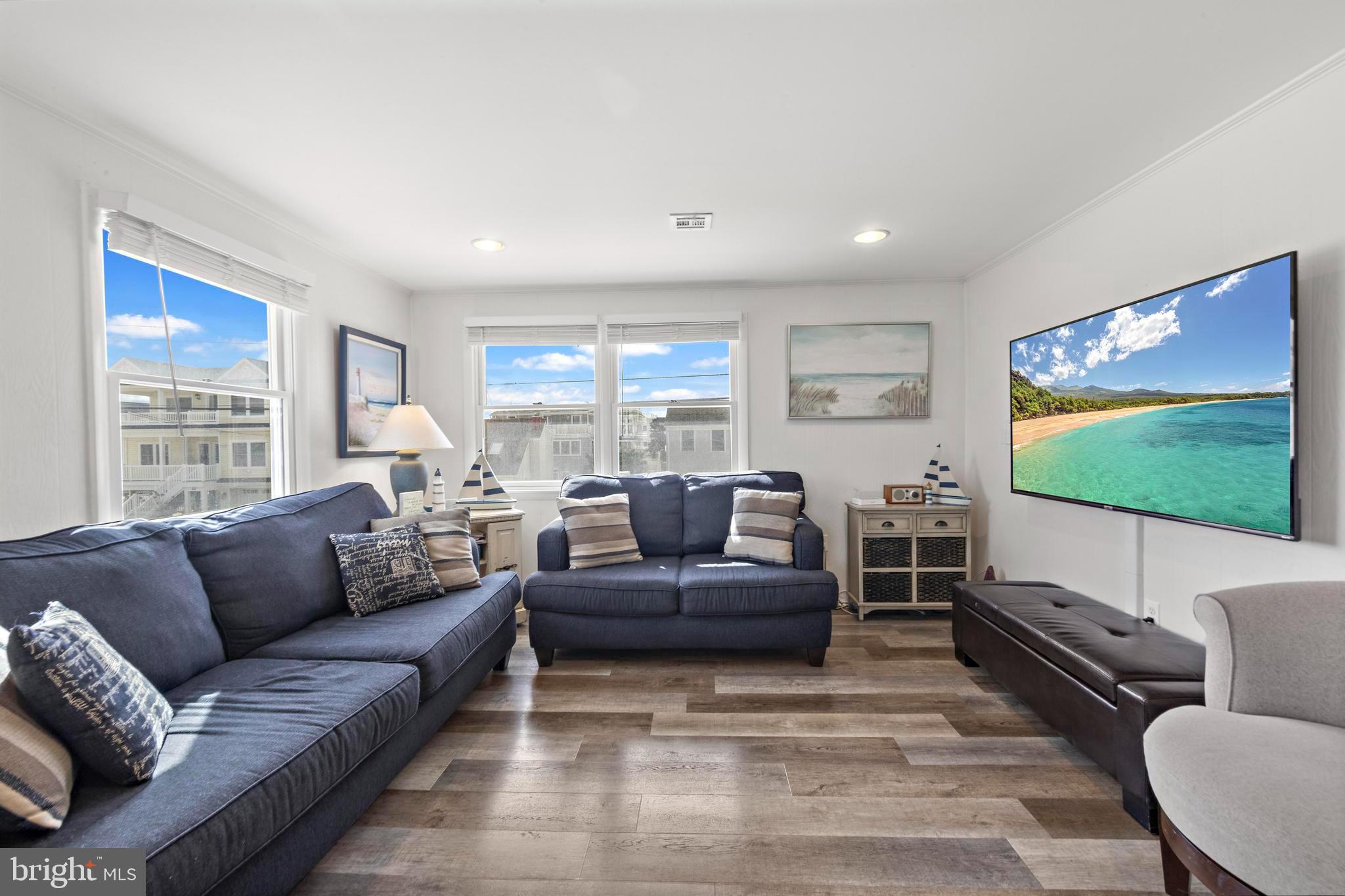 13 Joan Road, Unit 2 Long Beach Township, NJ 08008 - Photo 9 of 64 a living room with furniture and a flat screen tv