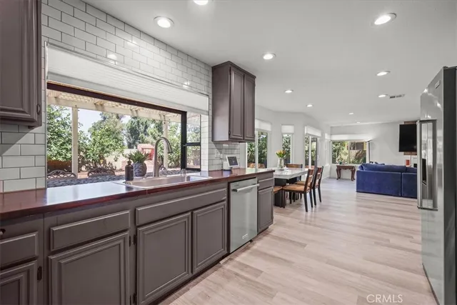 a kitchen with lots of counter top space and living room