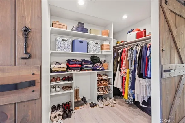 a bedroom with a bed and a lamp