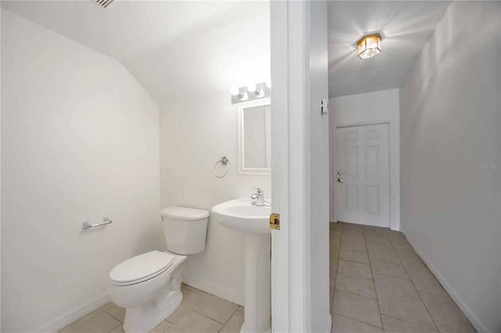 14980 Skip Jack Loop Lakewood Ranch, FL 34202 - Photo 13 of 39 a bathroom with a toilet a sink and mirror