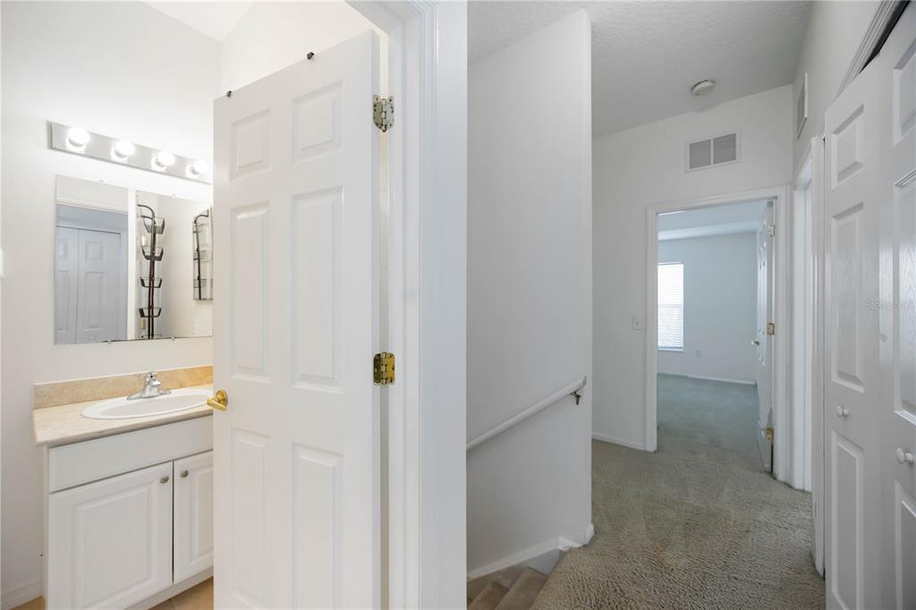 14980 Skip Jack Loop Lakewood Ranch, FL 34202 - Photo 15 of 39 a bathroom with a sink vanity and a mirror