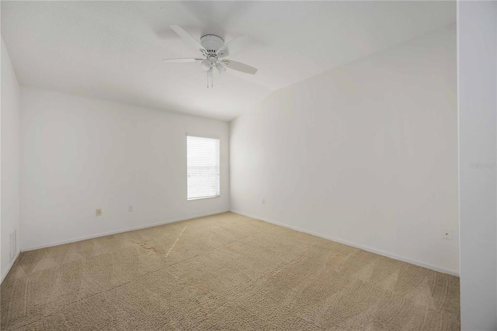 14980 Skip Jack Loop Lakewood Ranch, FL 34202 - Photo 16 of 39 a view of an empty room with a window