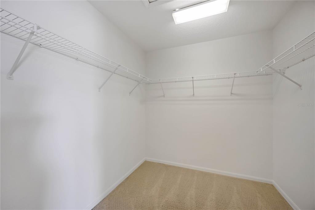 14980 Skip Jack Loop Lakewood Ranch, FL 34202 - Photo 17 of 39 a view of a room with racks on the wall