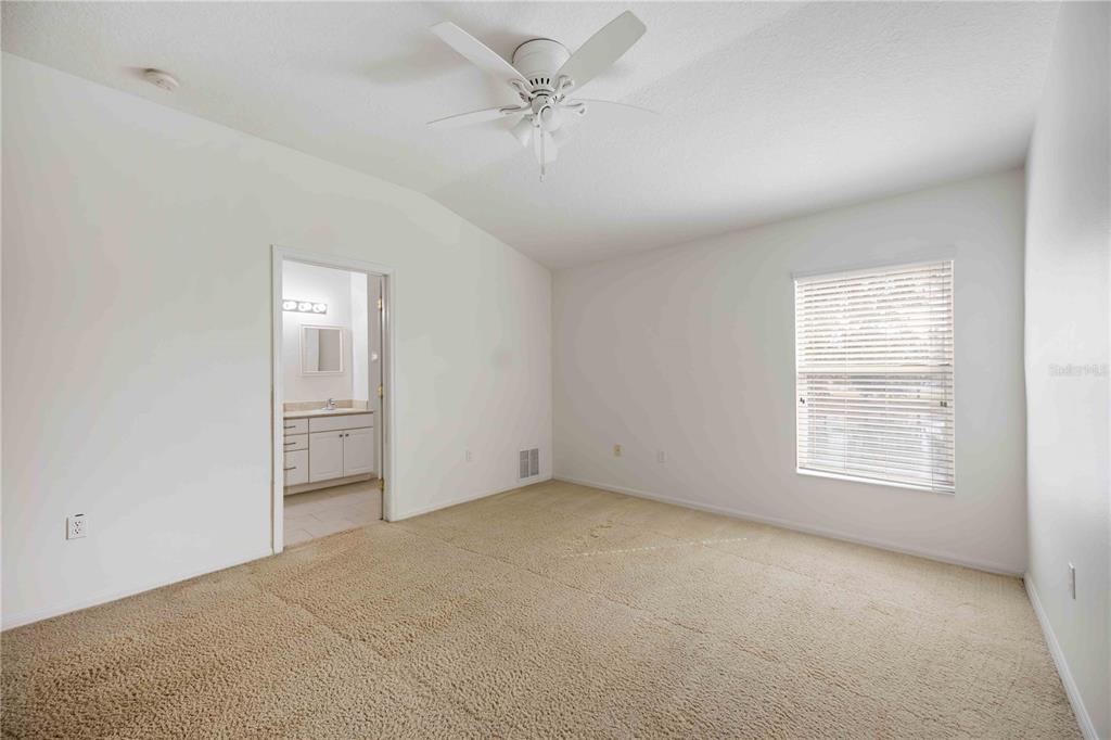 14980 Skip Jack Loop Lakewood Ranch, FL 34202 - Photo 18 of 39 an empty room with windows and fan