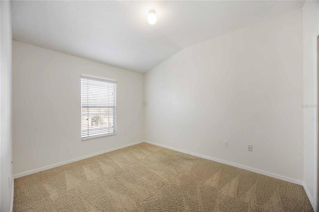14980 Skip Jack Loop Lakewood Ranch, FL 34202 - Photo 23 of 39 an empty room with a window