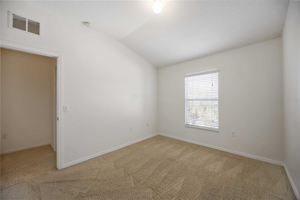 14980 Skip Jack Loop Lakewood Ranch, FL 34202 - Photo 24 of 39 an empty room with a window