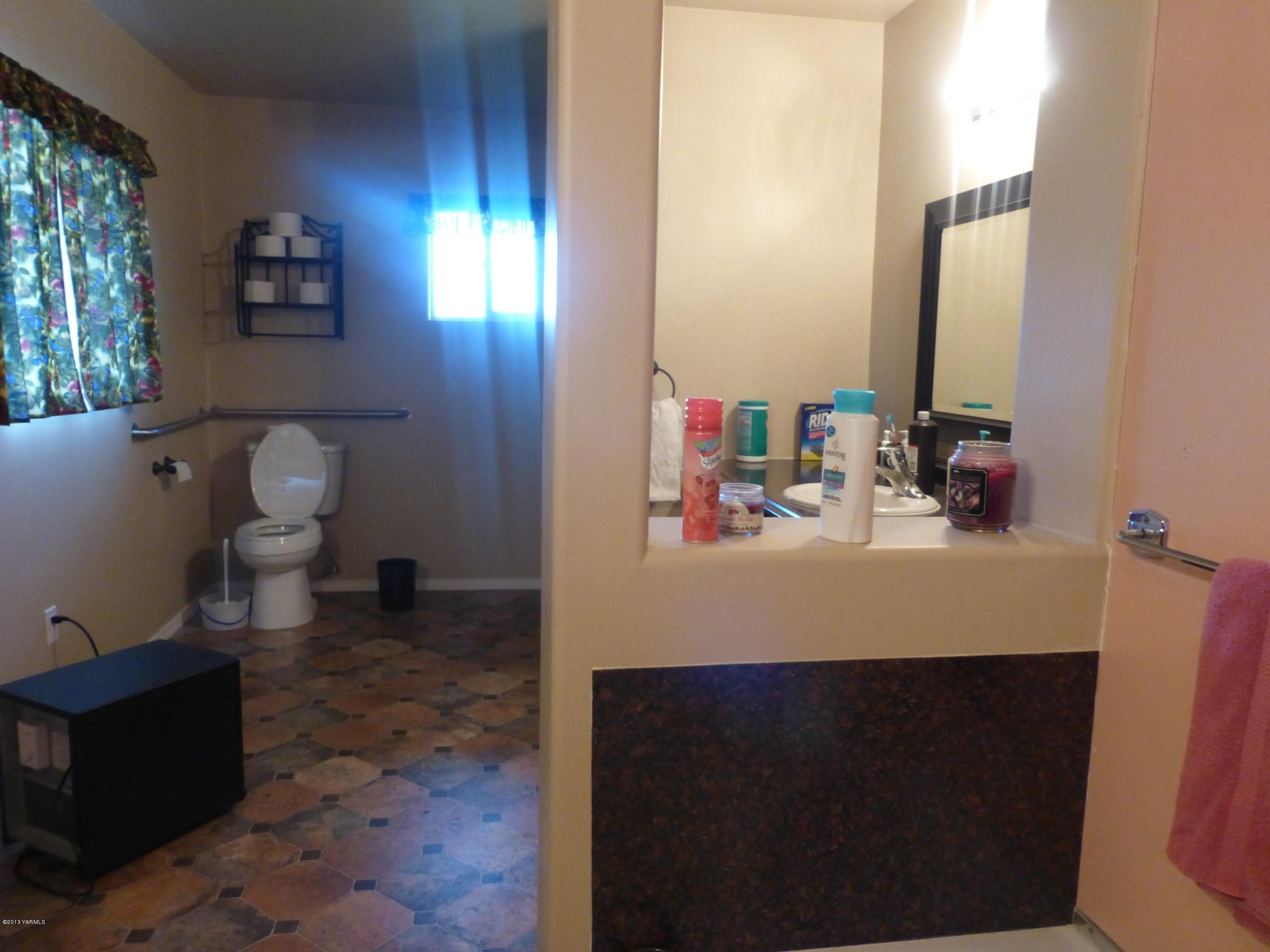 461 Barker Road Granger, WA 98932 - Photo 28 of 37 a bathroom with a sink toilet and mirror