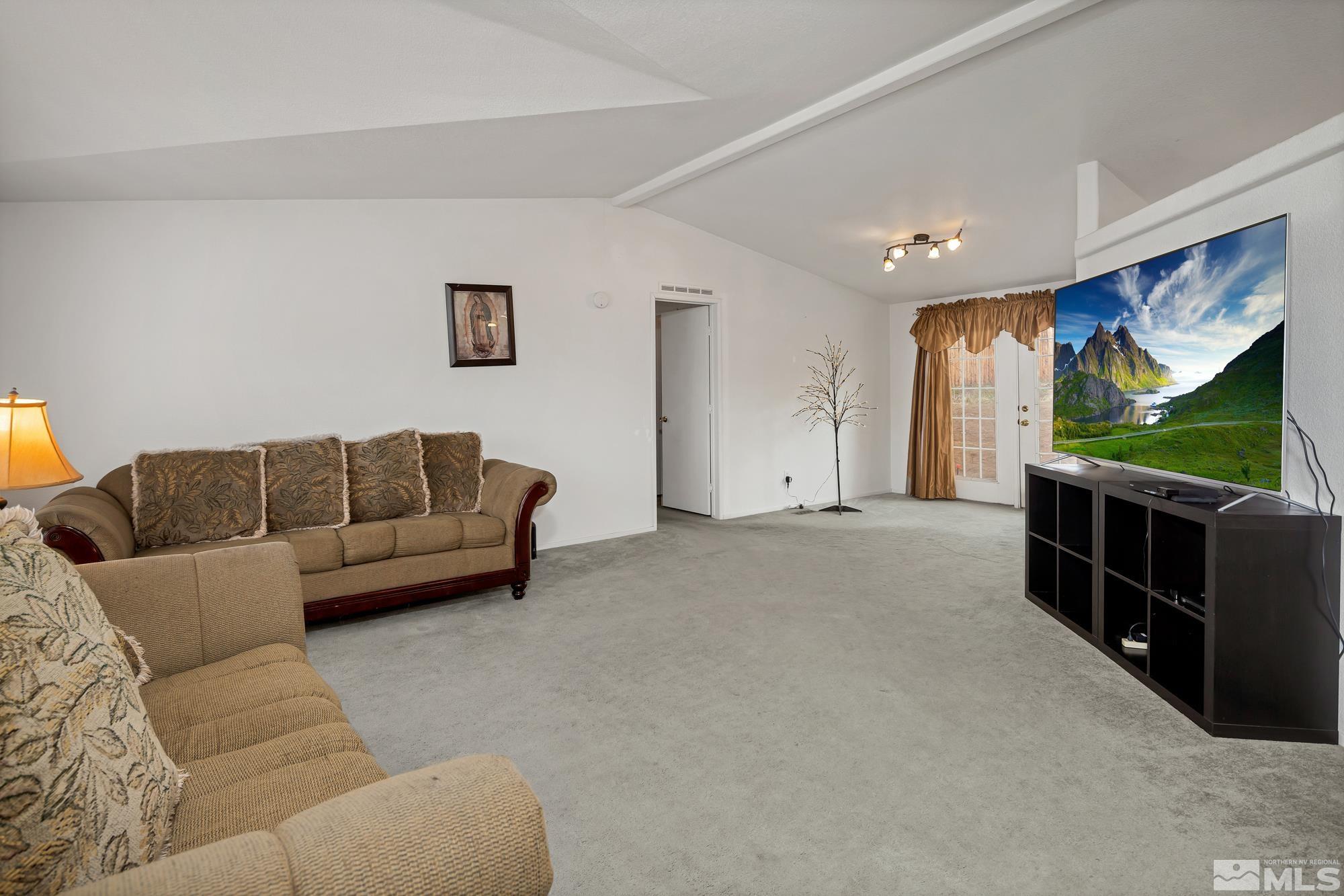 5159 Nanook Court Reno, NV 89506 - Photo 4 of 31 a living room with furniture and a flat screen tv