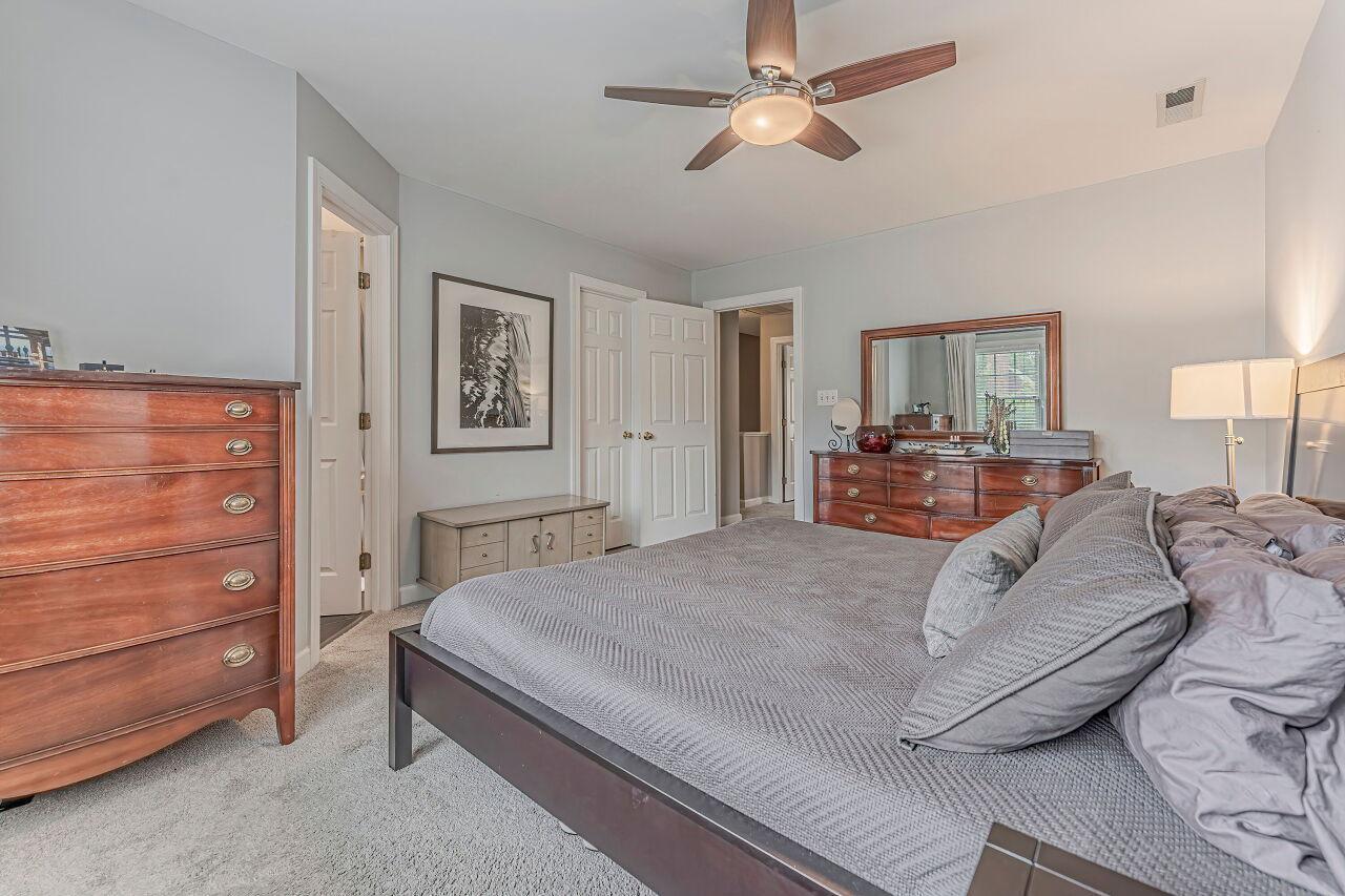 106 Hatfield Lane Raleigh, NC 27603 - Photo 20 of 29 a bedroom with a bed and a dresser