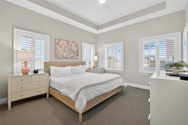 a dining room with stainless steel appliances kitchen island granite countertop a dining table chairs and a sink