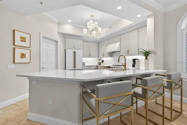 a living room with furniture fireplace and a large window