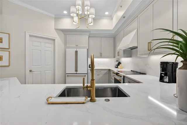 a dining room with furniture and a floor to ceiling window