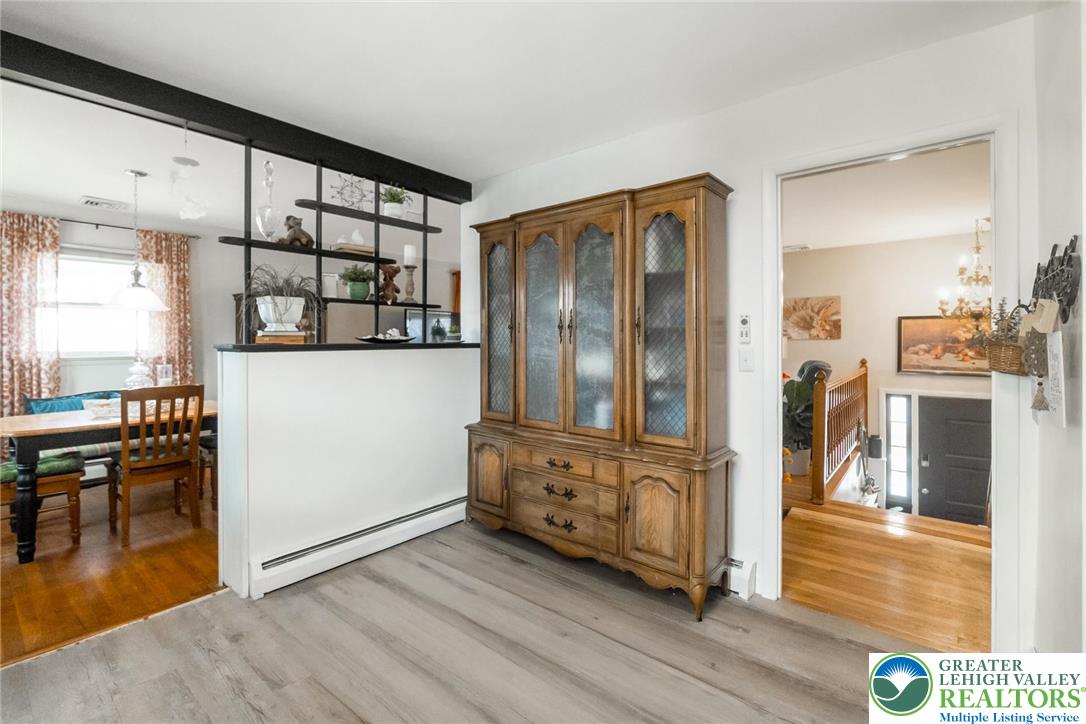 3218 Highland Road Orefield, PA 18069 - Photo 16 of 53 a view of a hallway with wooden floor and dining room