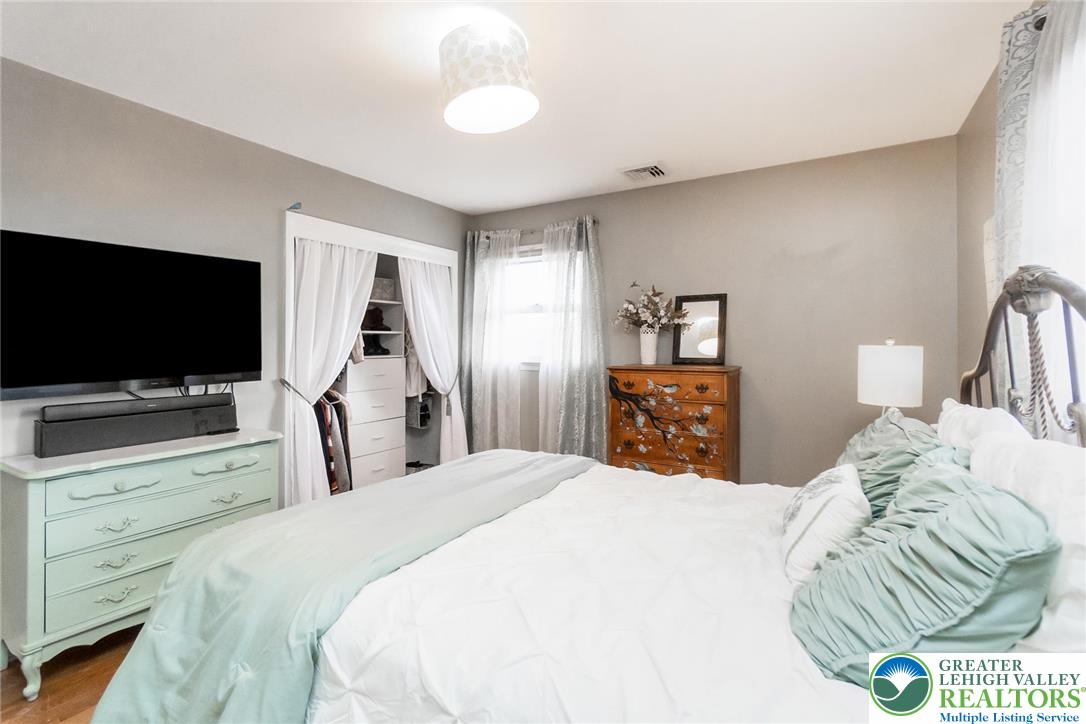3218 Highland Road Orefield, PA 18069 - Photo 22 of 53 a bedroom with a bed and a flat screen tv