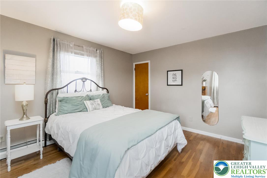 3218 Highland Road Orefield, PA 18069 - Photo 23 of 53 a bedroom with a bed and a table in it