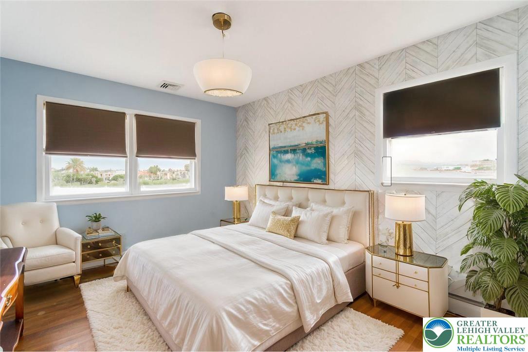 3218 Highland Road Orefield, PA 18069 - Photo 27 of 53 a bedroom with a large bed and a flat tv screen on dresser