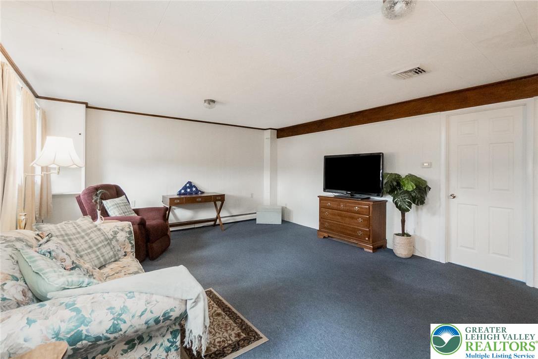 3218 Highland Road Orefield, PA 18069 - Photo 41 of 53 a living room with furniture and a flat screen tv