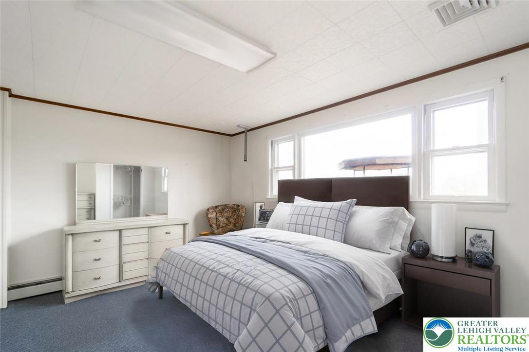 3218 Highland Road Orefield, PA 18069 - Photo 43 of 53 a bedroom with a bed and a large window