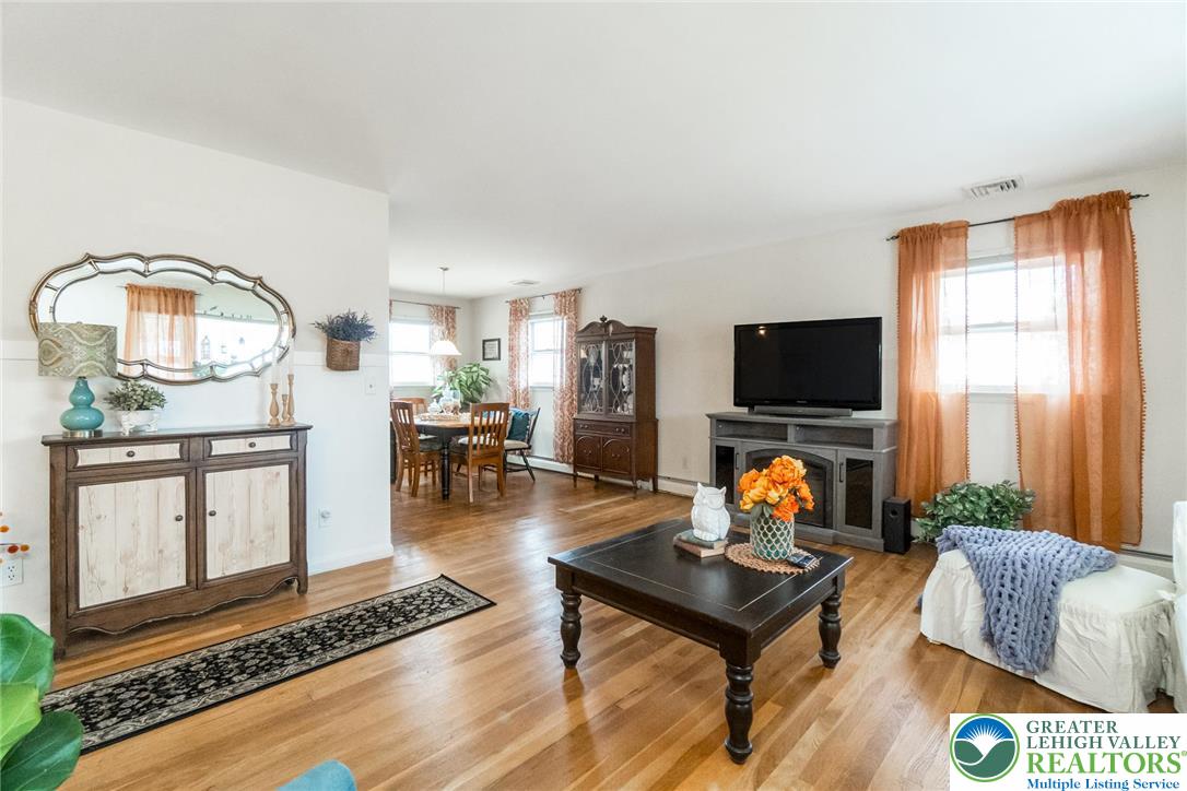 3218 Highland Road Orefield, PA 18069 - Photo 10 of 53 a living room with furniture and a flat screen tv