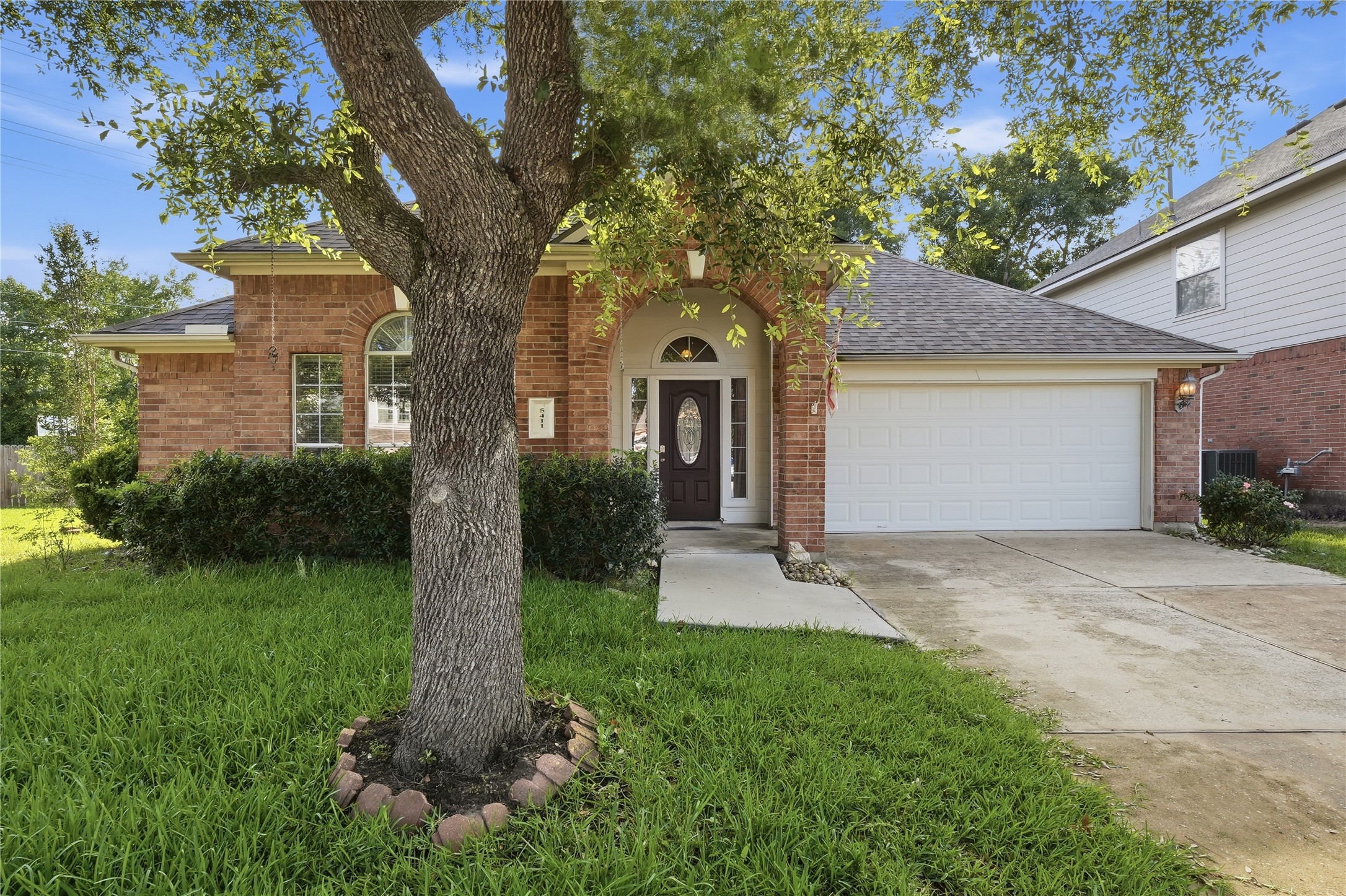 5411 Gate Canyon Court Spring, TX 77373 - Photo 2 of 33 a front view of a house with garden