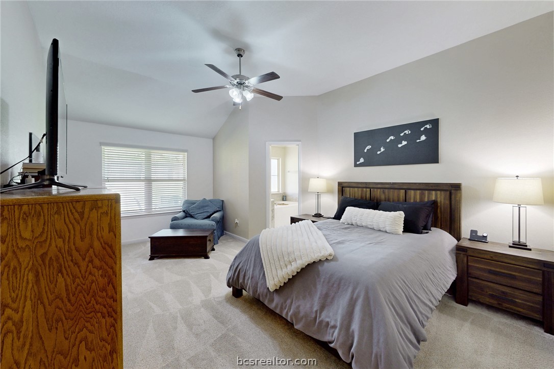 2071 Positano Loop Bryan, TX 77808 - Photo 13 of 31 a bedroom with bed window and couch