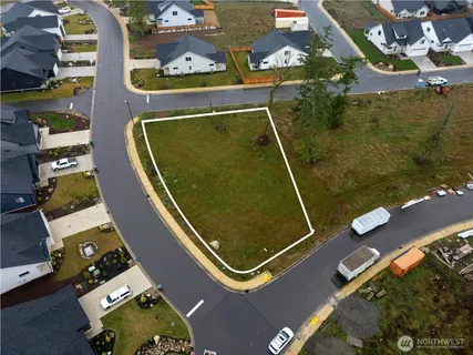 an aerial view of residential house with outdoor space and swimming pool