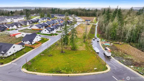 a view of a swimming pool with a yard