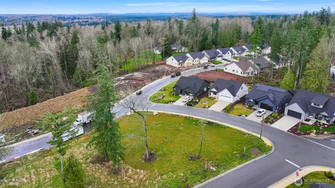 a view of a swimming pool with a yard and mountain view