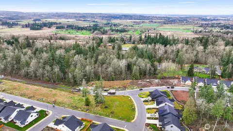 a view of a lake with couches and city view