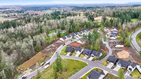 an aerial view of a house with a swimming pool