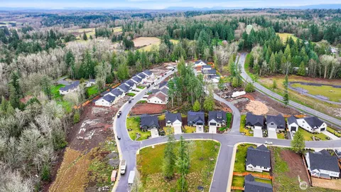an aerial view of a house with a swimming pool yard and outdoor seating