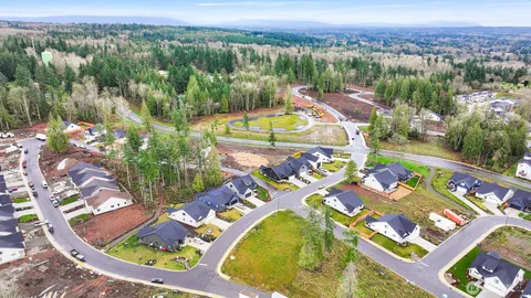 an aerial view of a swimming pool with a yard