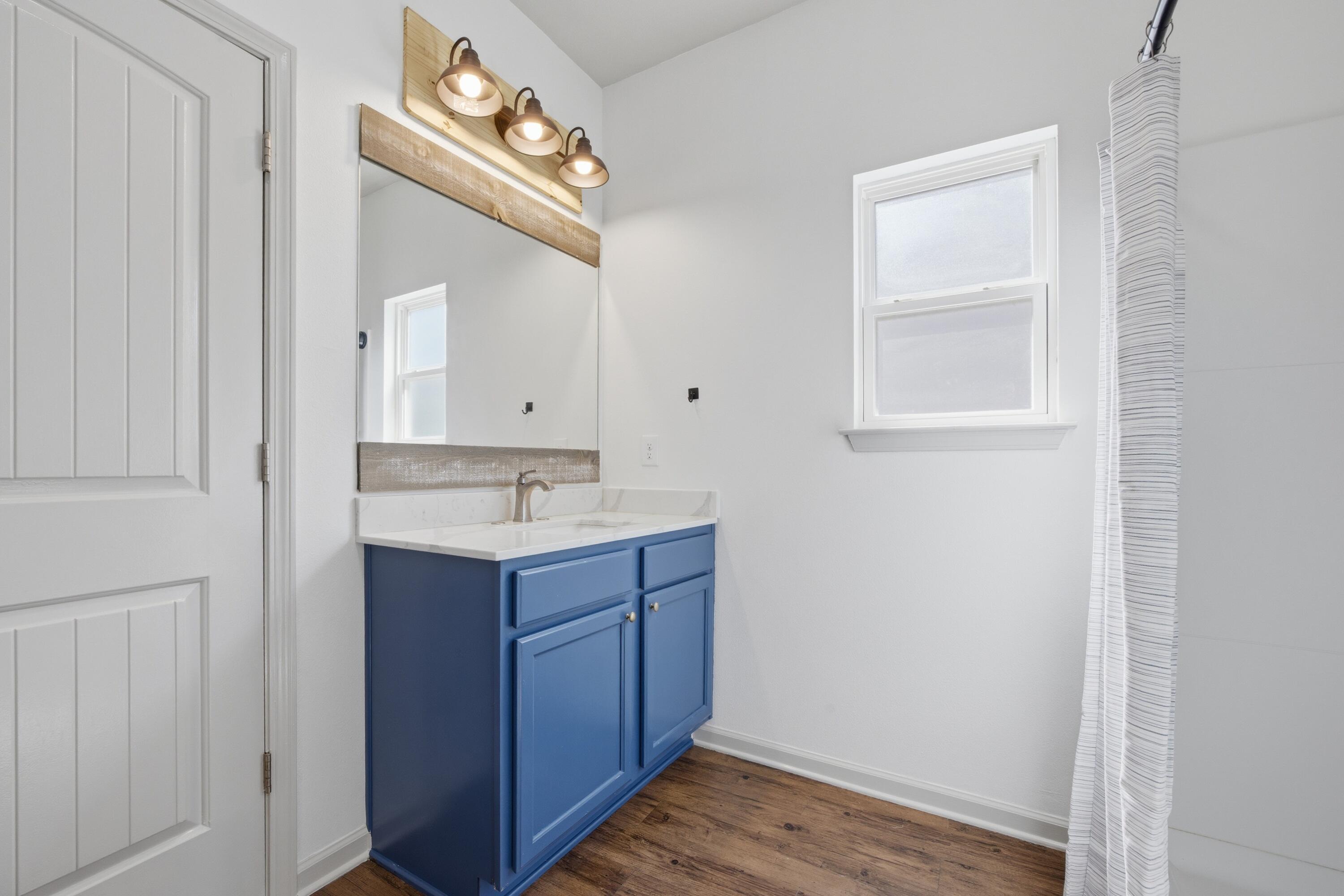 102 Cornelia Street Freeport, FL 32439 - Photo 12 of 39 a bathroom with a sink and a mirror