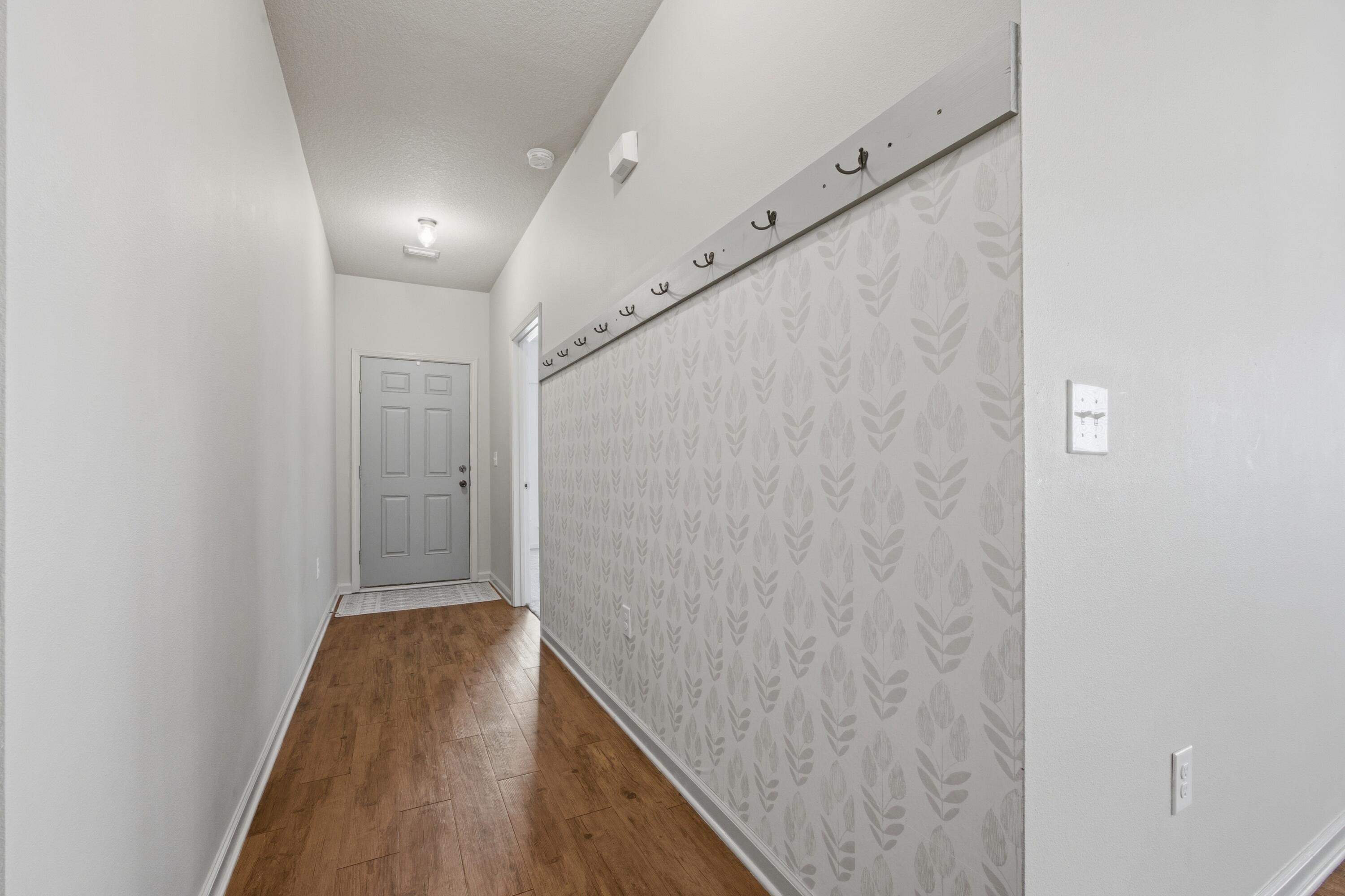 102 Cornelia Street Freeport, FL 32439 - Photo 15 of 39 a view of hallway with wooden floor