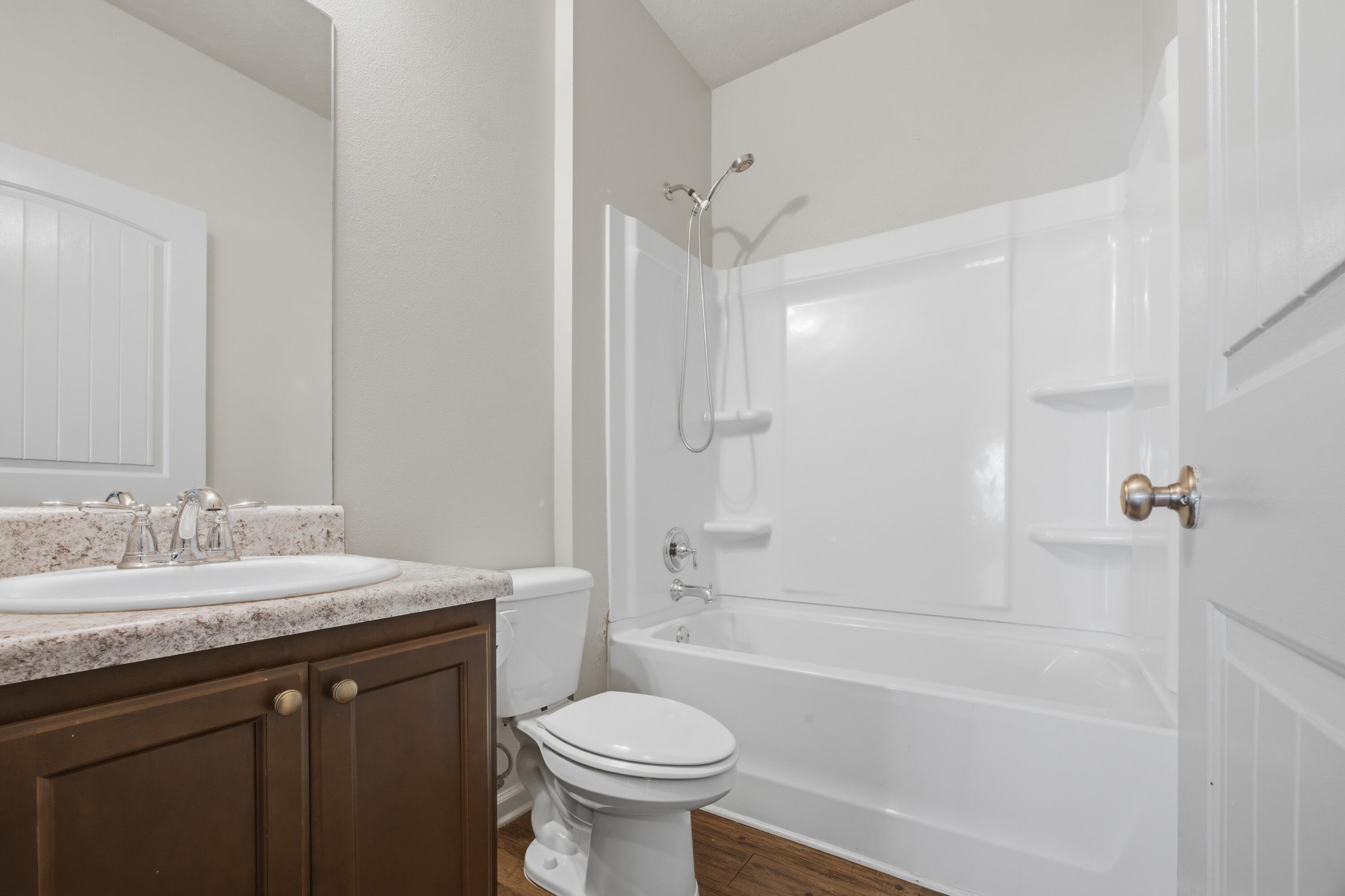 102 Cornelia Street Freeport, FL 32439 - Photo 20 of 39 a bathroom with a sink a toilet and a bathtub