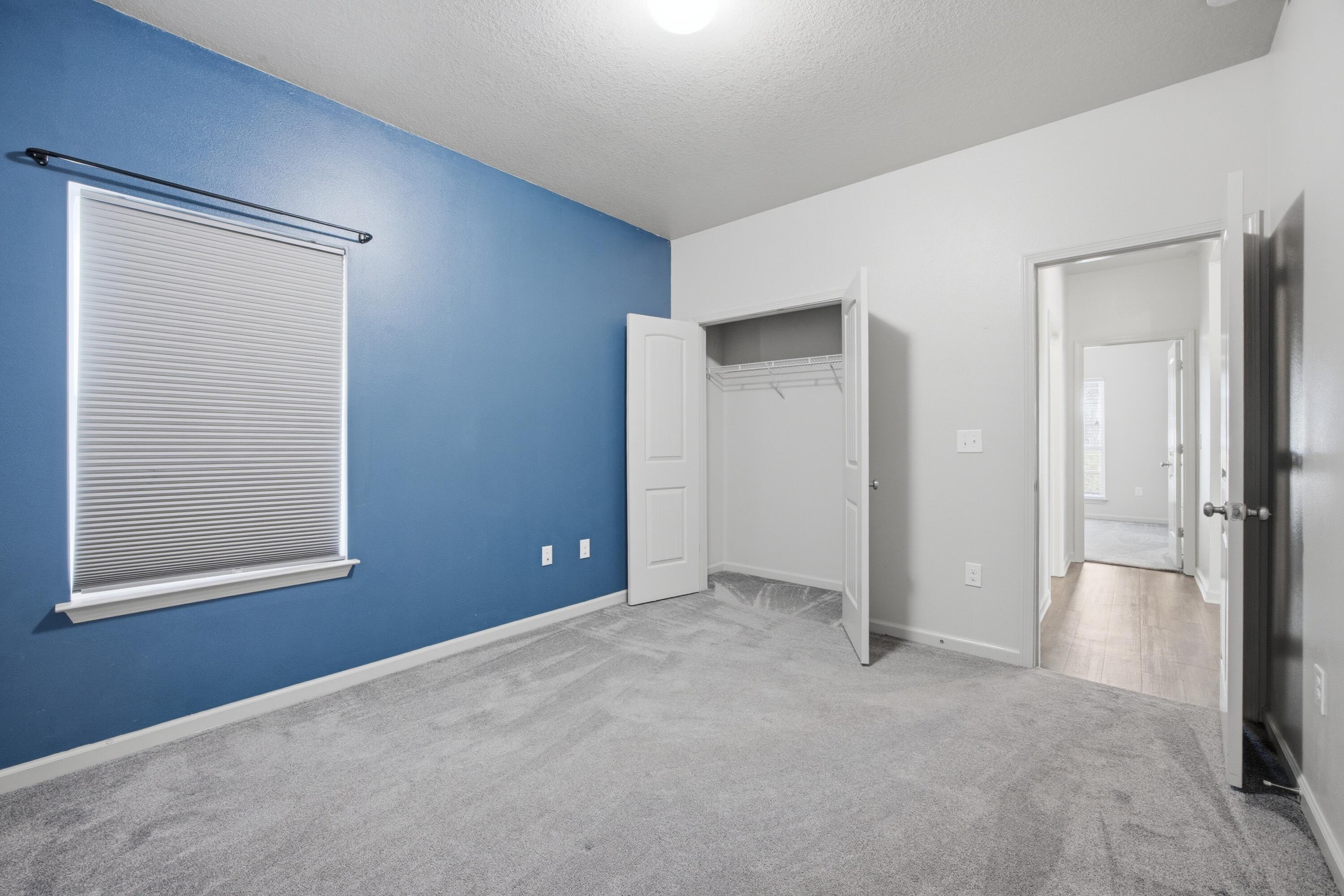 102 Cornelia Street Freeport, FL 32439 - Photo 27 of 39 an empty room with windows and closet