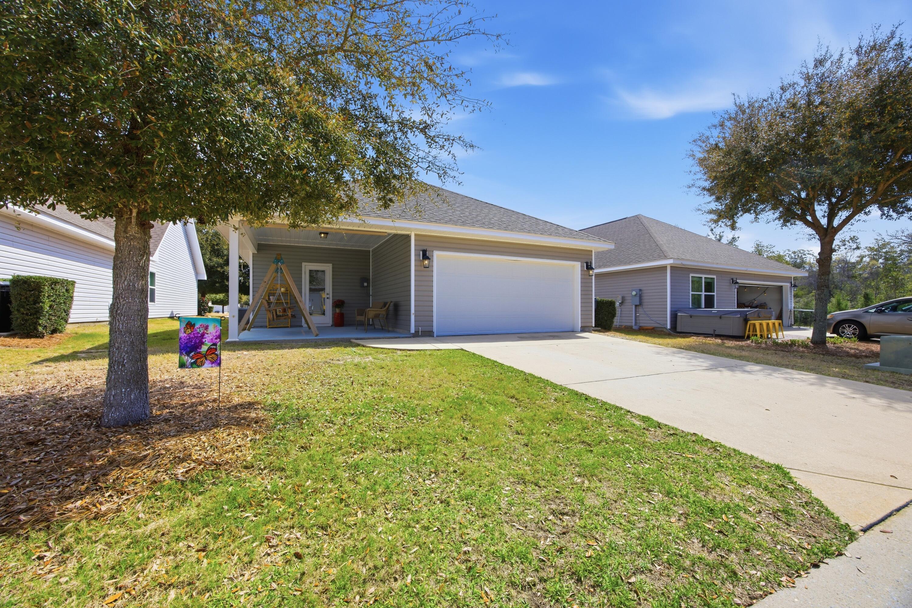 102 Cornelia Street Freeport, FL 32439 - Photo 38 of 39 a view of house with outdoor space and porch