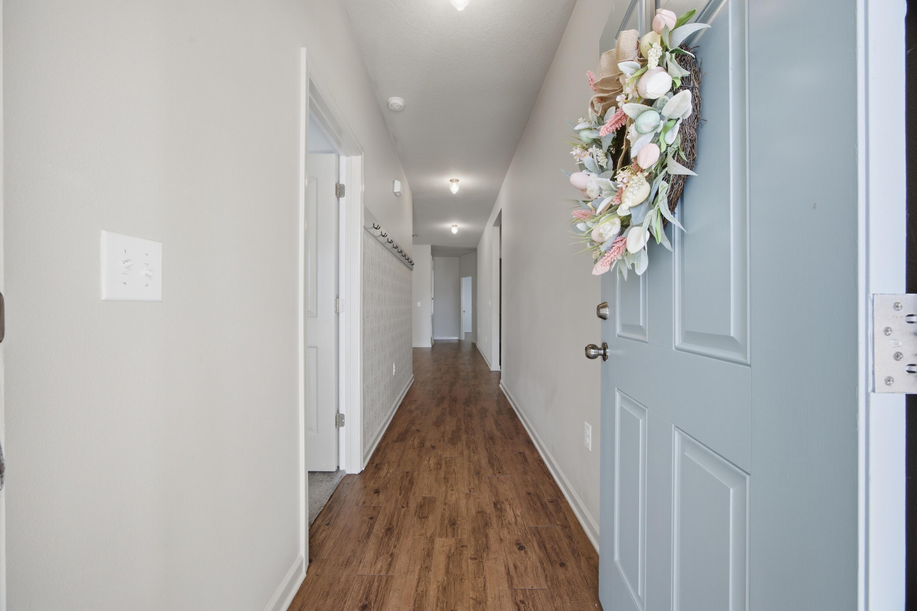102 Cornelia Street Freeport, FL 32439 - Photo 7 of 39 a view of a hallway with wooden floor
