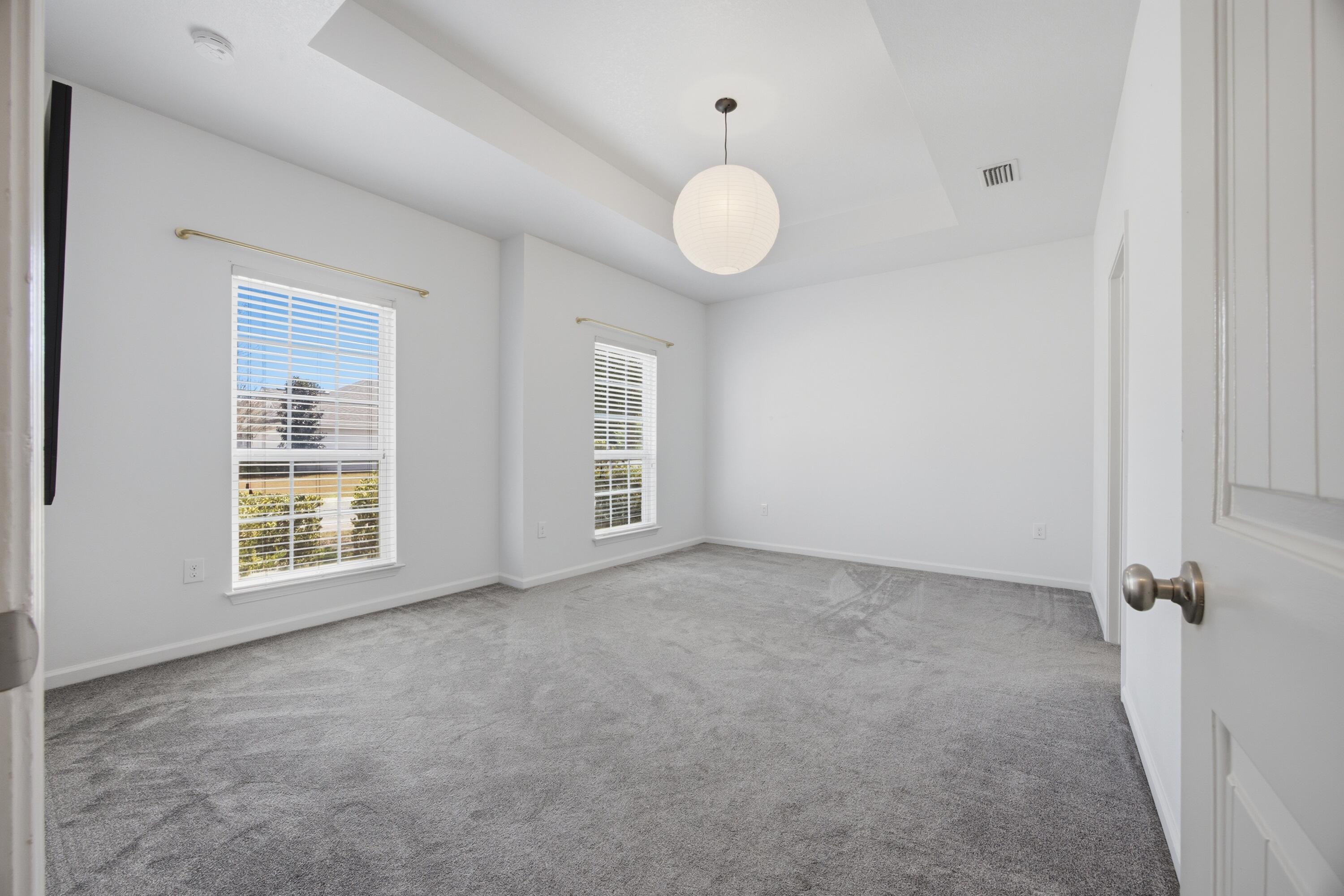 102 Cornelia Street Freeport, FL 32439 - Photo 8 of 39 an empty room with windows