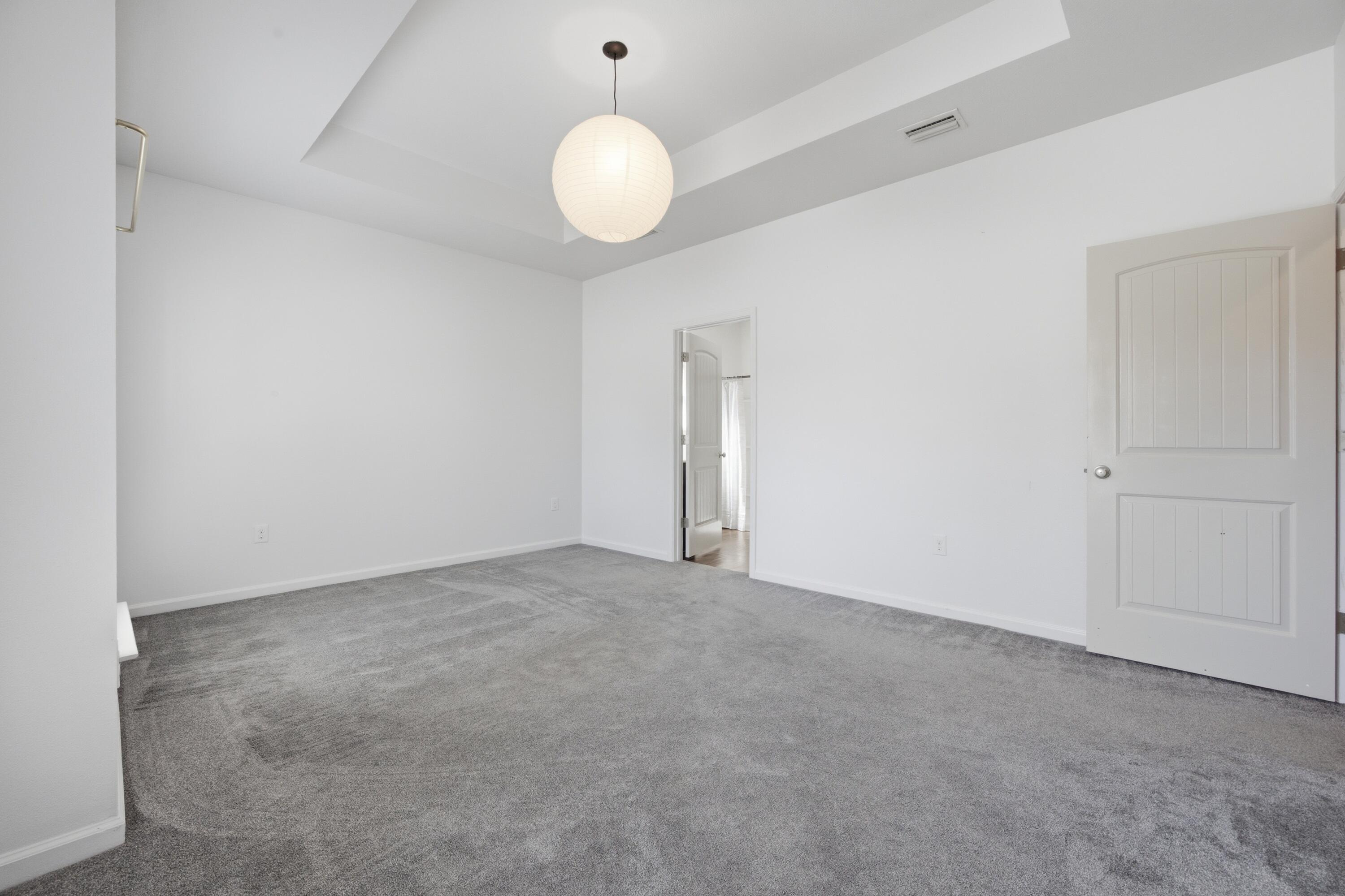 102 Cornelia Street Freeport, FL 32439 - Photo 9 of 39 a view of an empty room with wooden floor