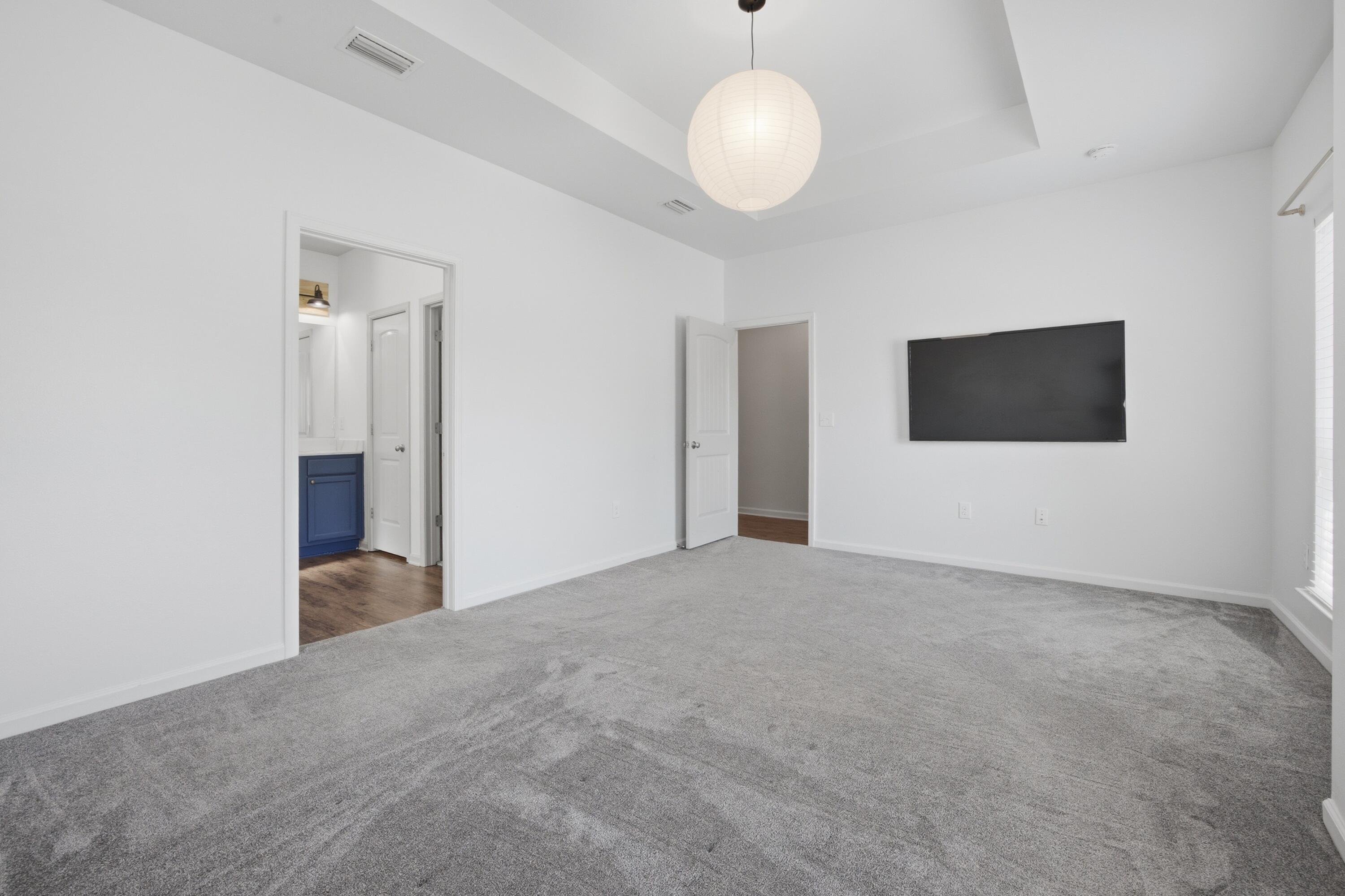 102 Cornelia Street Freeport, FL 32439 - Photo 10 of 39 a view of an empty room with wooden floor