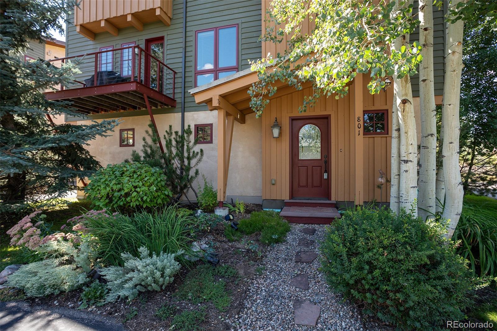 801 Majestic Circle Steamboat Springs, CO 80487 - Photo 1 of 37 a front view of a house with garden