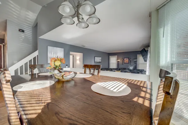 a living room with furniture dining table and a fireplace