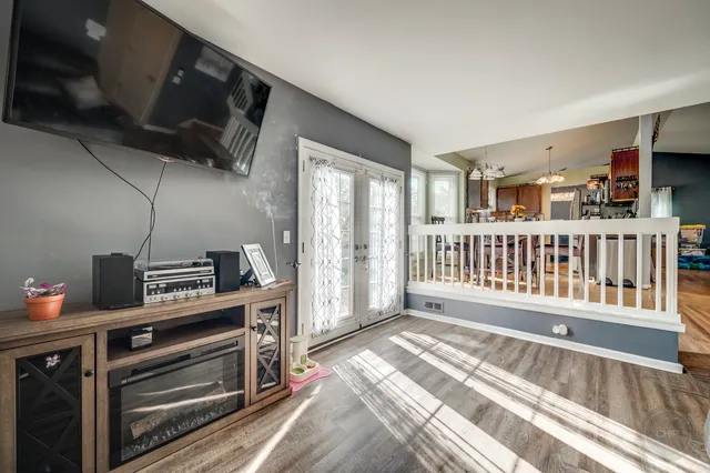 a bathroom with a granite countertop toilet sink and mirror