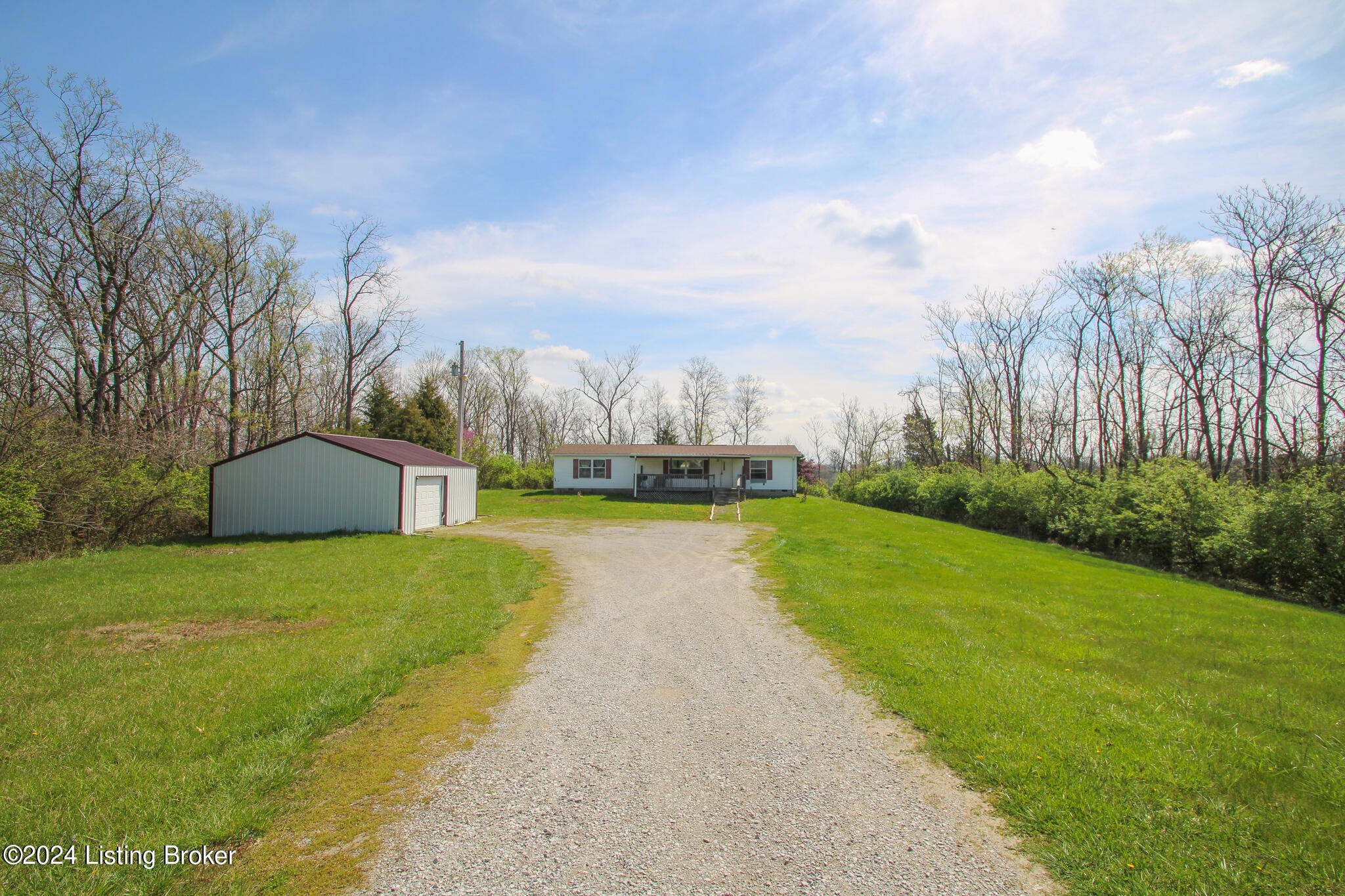 686 Windy Ridge Road Bedford, KY 40006 - Photo 3 of 42 View of home and garage and acreage