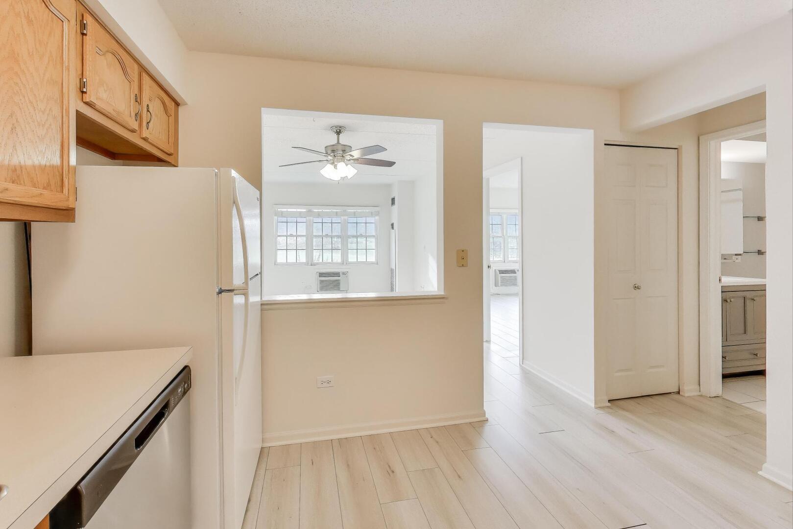 1220 Depot Street, Unit 109 Glenview, IL 60025 - Photo 12 of 35 a view of a room with wooden floor and cabinet