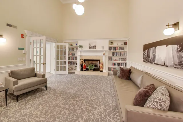 a lobby with furniture and a potted plant