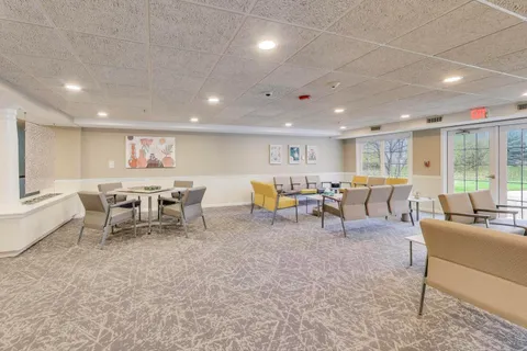 a living room with lots of furniture and a table